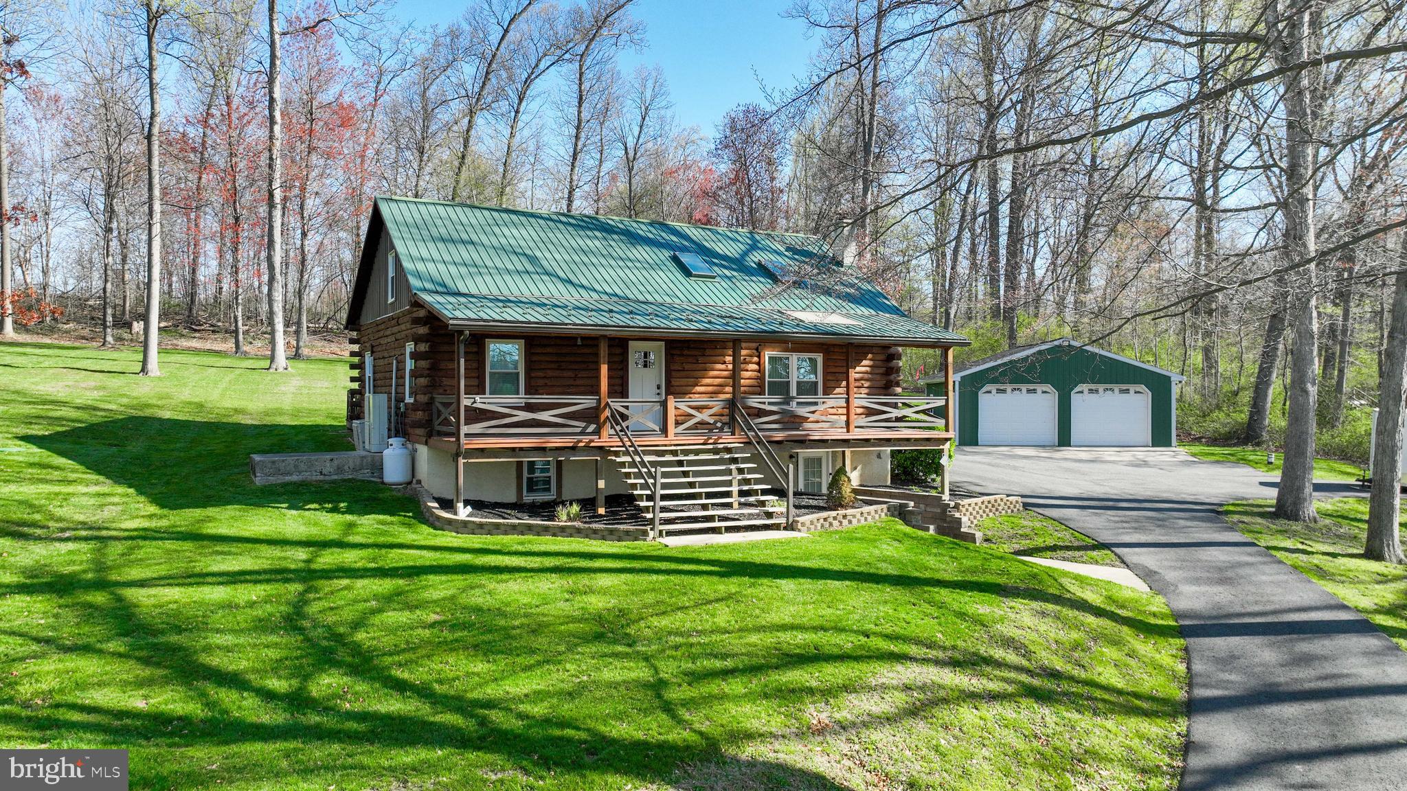 13 Upper Valley Road Christiana, PA 17509 - Photo 1 of 60 a front view of a house with garden