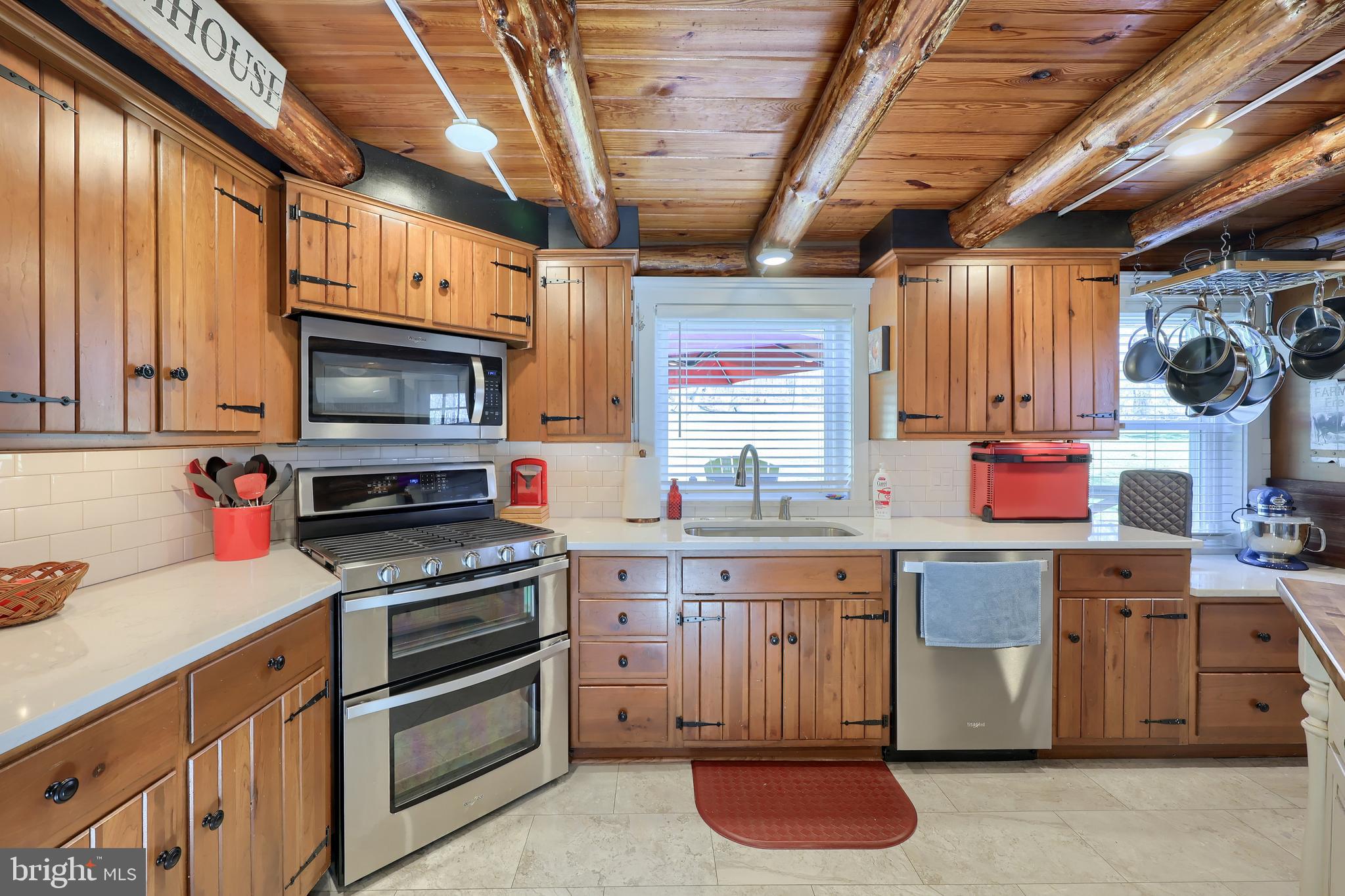 13 Upper Valley Road Christiana, PA 17509 - Photo 14 of 60 a kitchen with granite countertop wooden cabinets stainless steel appliances and a counter space