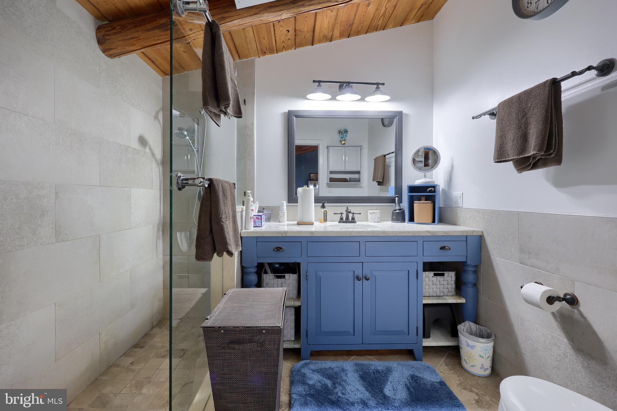 13 Upper Valley Road Christiana, PA 17509 - Photo 29 of 60 a bathroom with a granite countertop sink a toilet and mirror