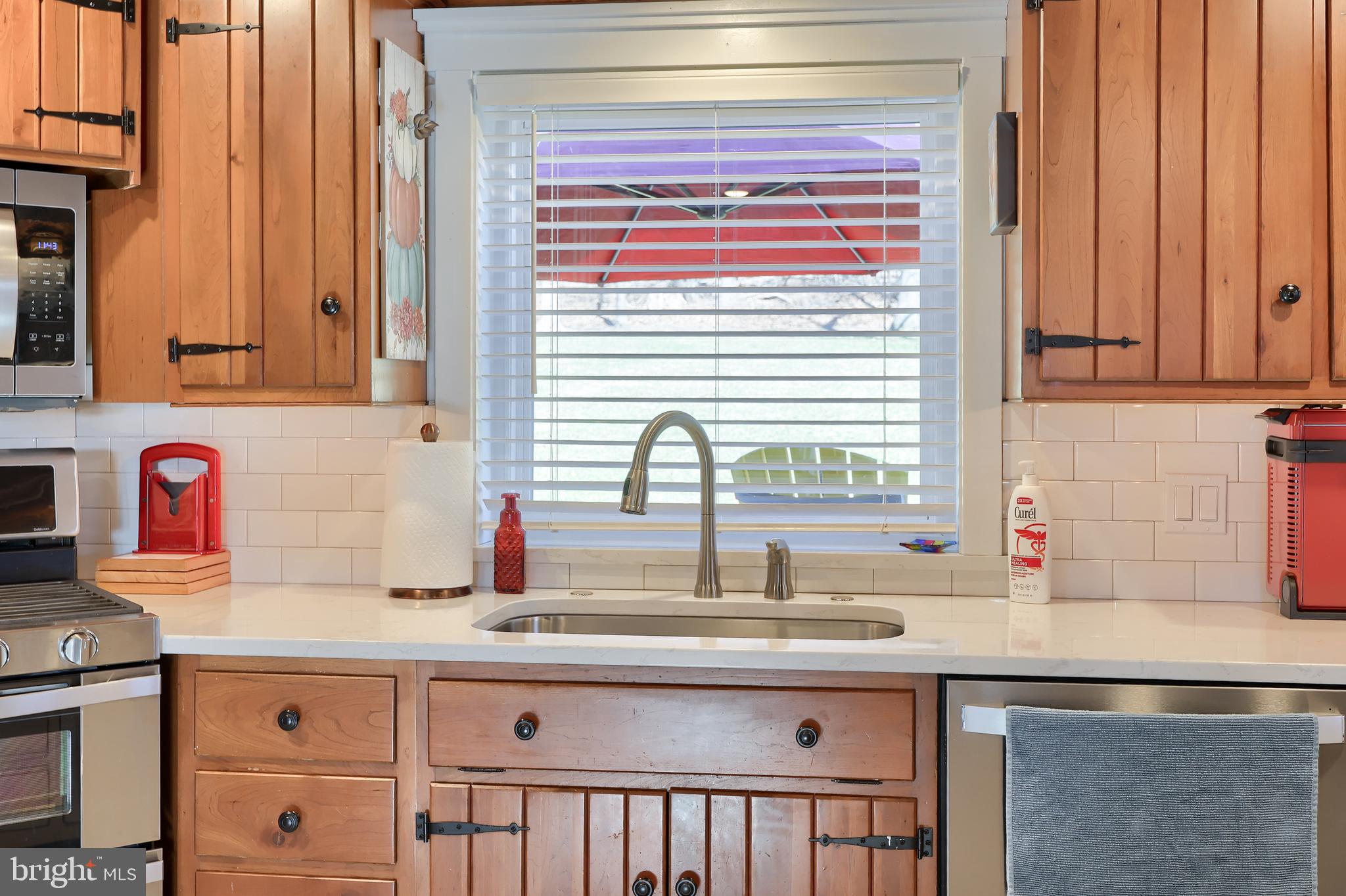 13 Upper Valley Road Christiana, PA 17509 - Photo 8 of 60 a kitchen with stainless steel appliances granite countertop a sink and a wooden cabinets