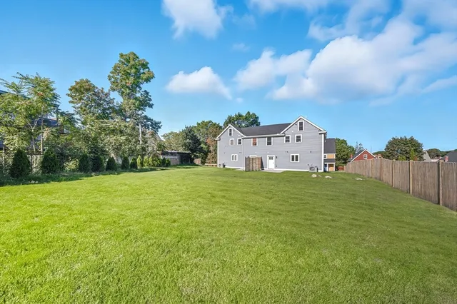 a house with a field in front of it