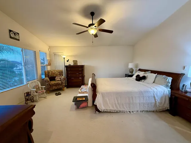a bathroom with a tub a sink and a mirror