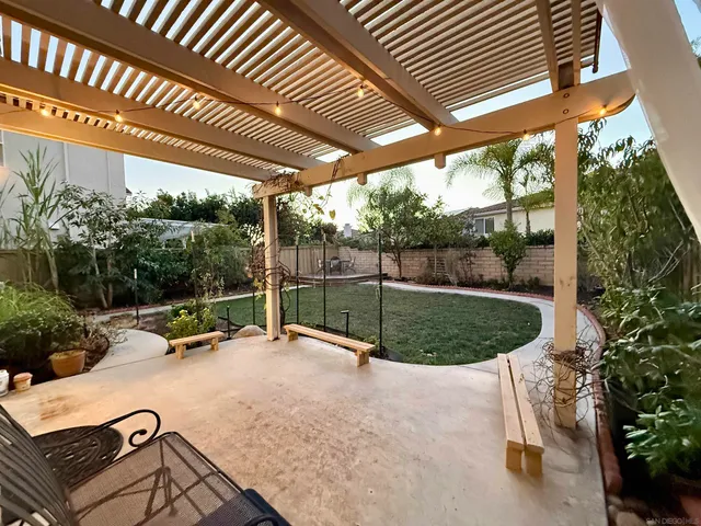 a view of a backyard with sitting area