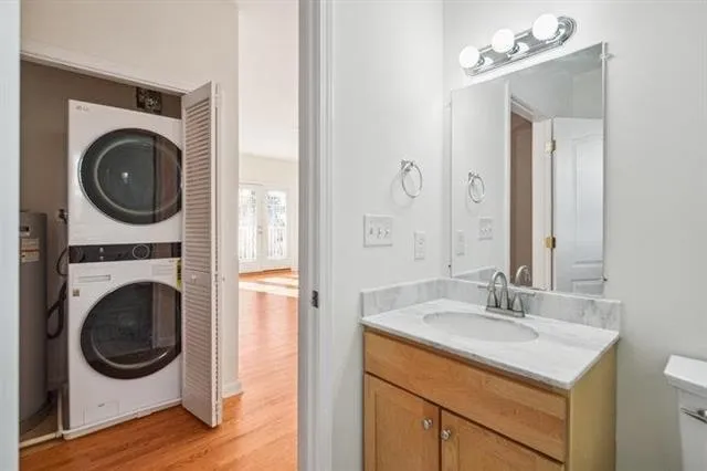 a utility room with sink dryer and washer