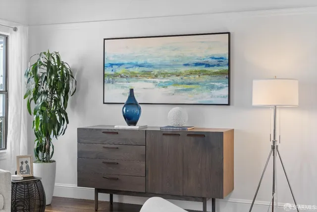 a dining room with furniture a view and wooden floor
