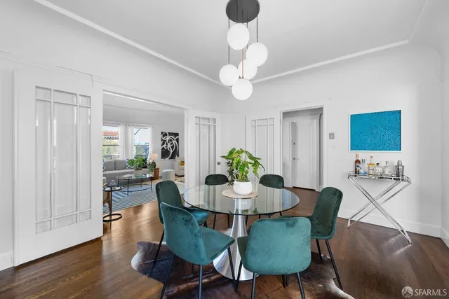 a kitchen with granite countertop white cabinets and stainless steel appliances