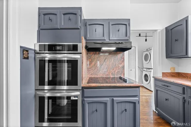 a bedroom with a bed and painting on the wall
