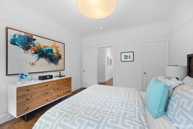 a view of a patio with couple of chairs and a fire pit