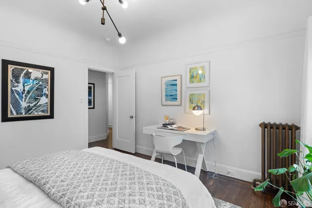 a living room with furniture and kitchen view