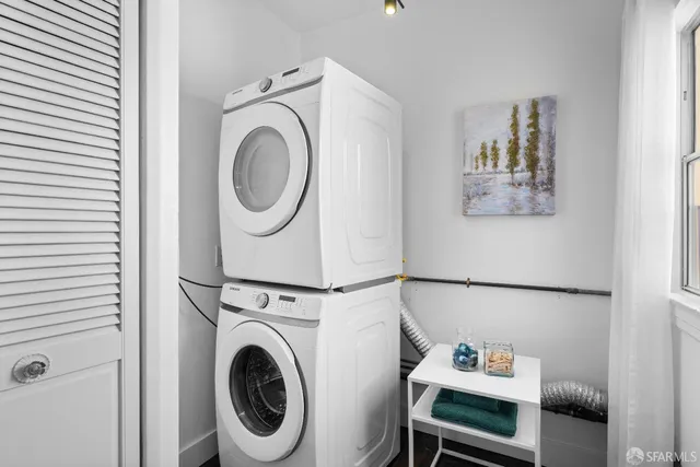 a bedroom with a large bed and a large window