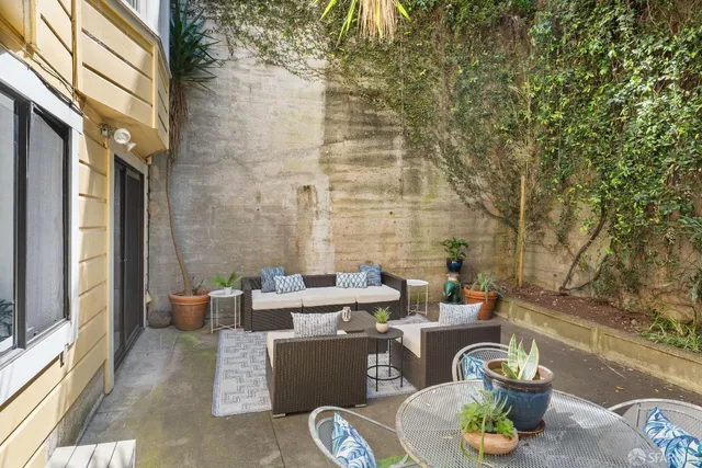 a view of a livingroom with furniture and windows