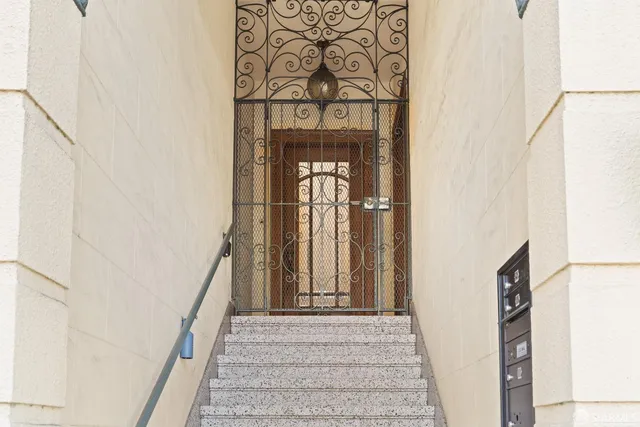 a kitchen with stainless steel appliances granite countertop a refrigerator and a stove