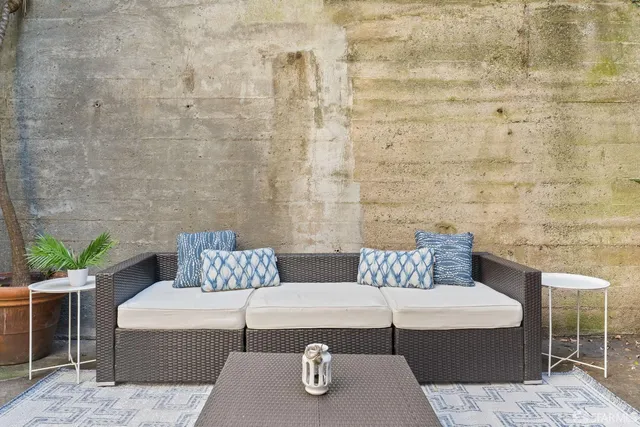 a kitchen with a table chairs sink and refrigerator