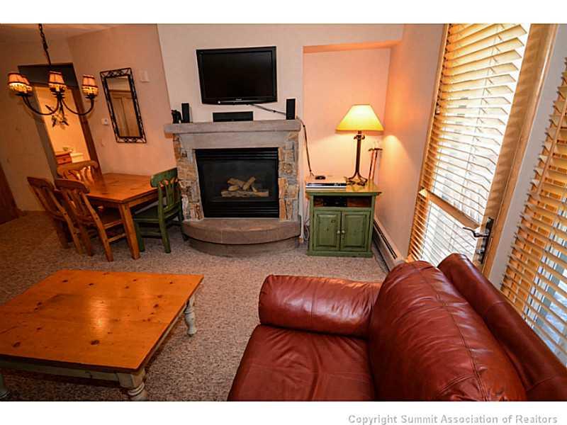 195 River Run Road, Unit 8042 Keystone, CO 80435 - Photo 12 of 25 a living room with furniture and a fireplace