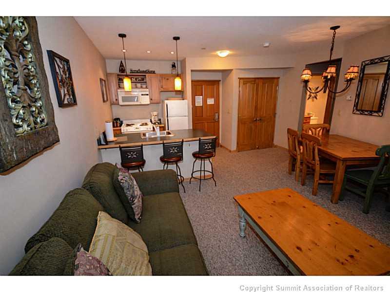 195 River Run Road, Unit 8042 Keystone, CO 80435 - Photo 13 of 25 a living room with furniture kitchen view and a table