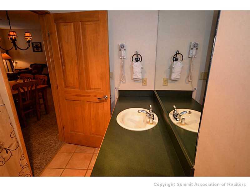 195 River Run Road, Unit 8042 Keystone, CO 80435 - Photo 18 of 25 a bathroom with a sink and a mirror