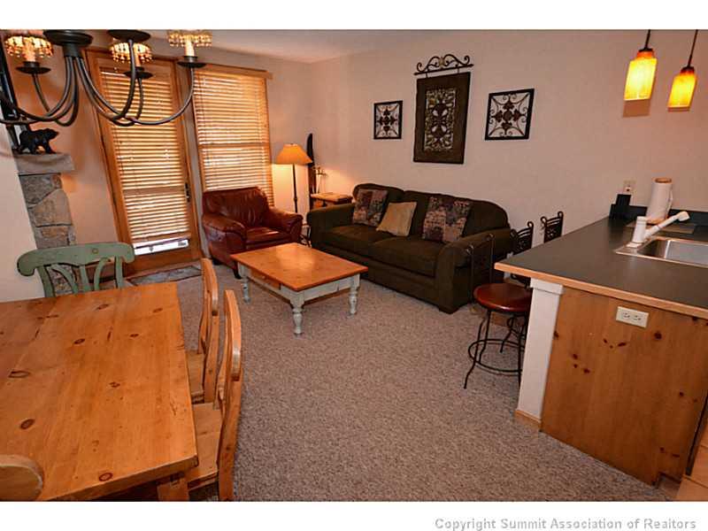 195 River Run Road, Unit 8042 Keystone, CO 80435 - Photo 21 of 25 a living room with furniture and a flat screen tv