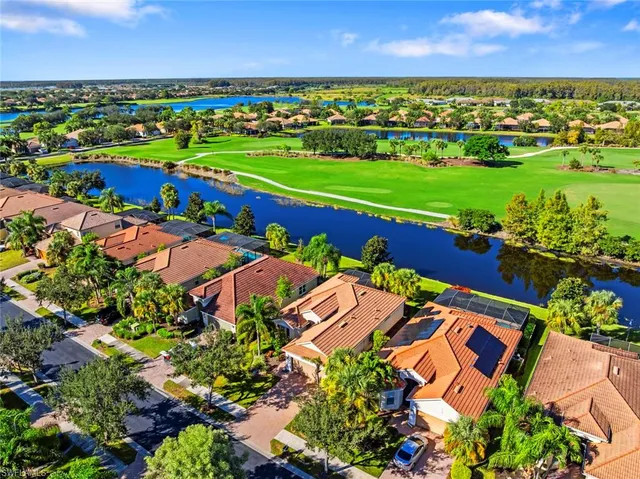 an aerial view of a houses with outdoor space and street view