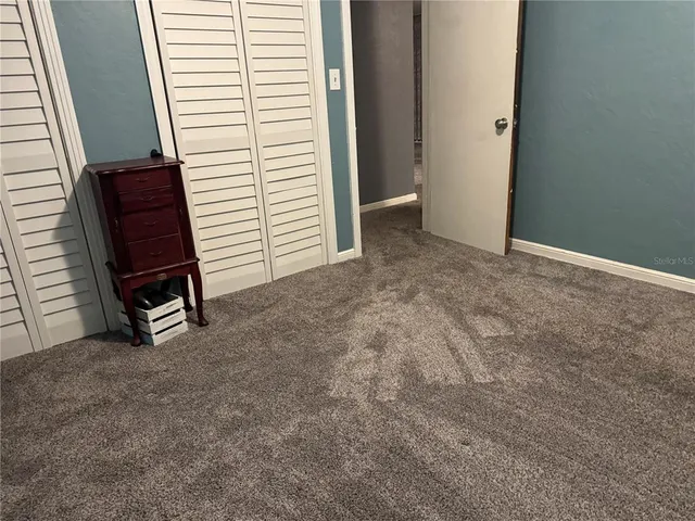 a kitchen with granite countertop a sink and cabinets