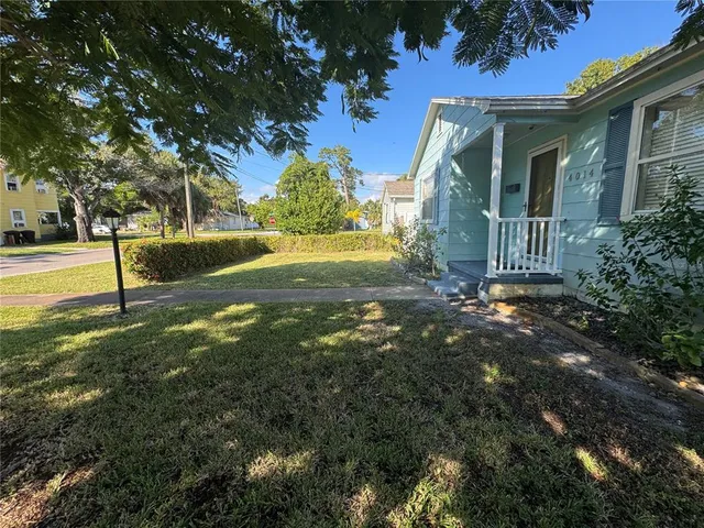 a view of a room with wooden floor and windows
