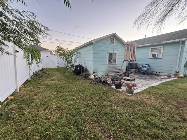 a view of a backyard of the house