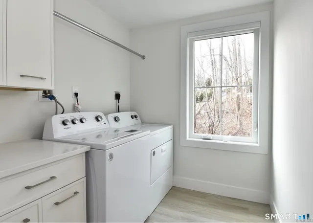 a utility room with a window dryer and washer