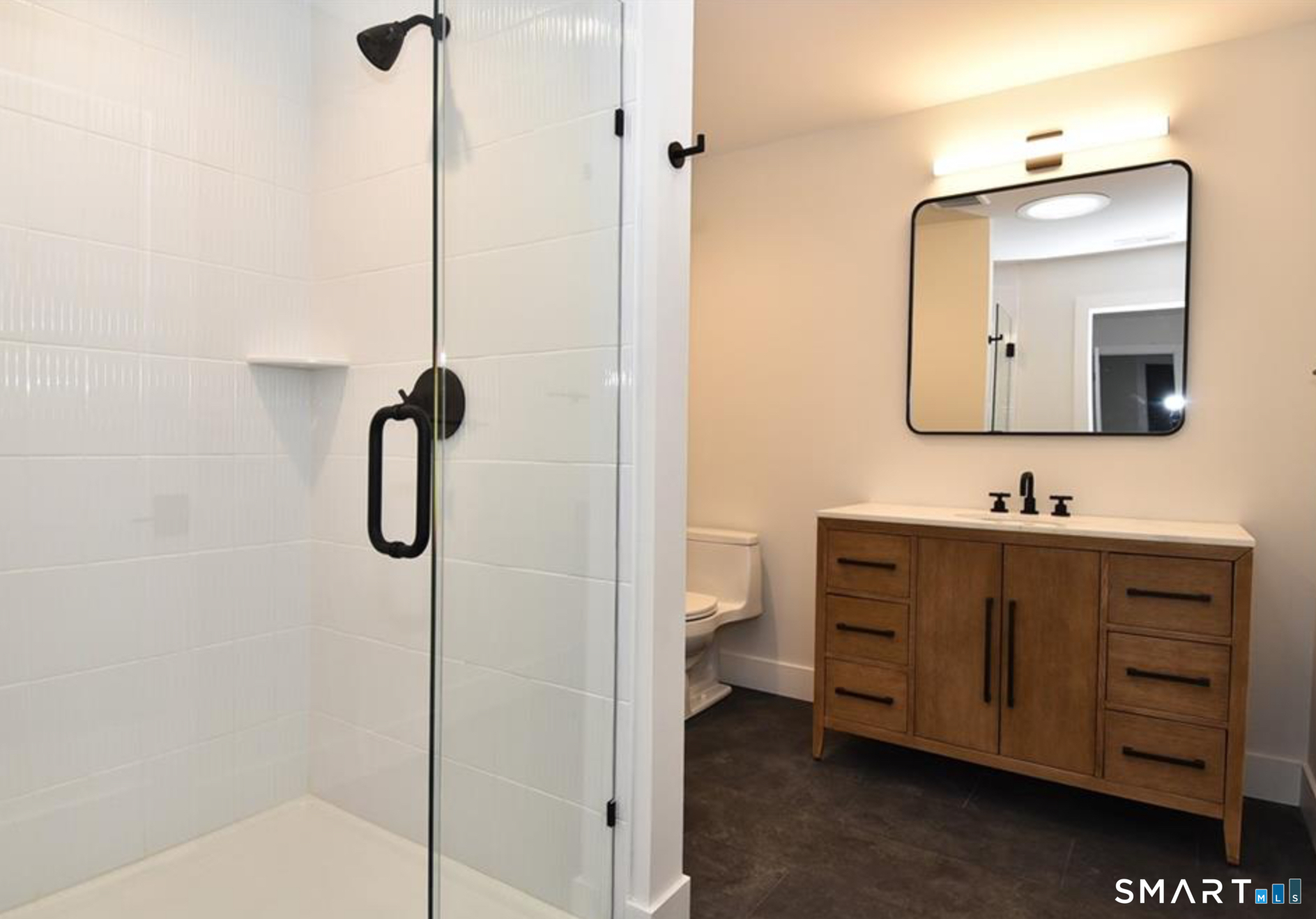 40 Fullin Road, Unit 19 Norwalk, CT 06851 - Photo 19 of 24 a bathroom with a double vanity sink mirror and toilet