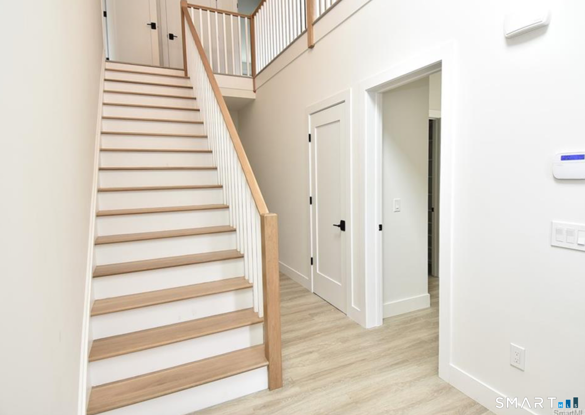 40 Fullin Road, Unit 19 Norwalk, CT 06851 - Photo 2 of 24 a view of a hallway with wooden floor and entryway