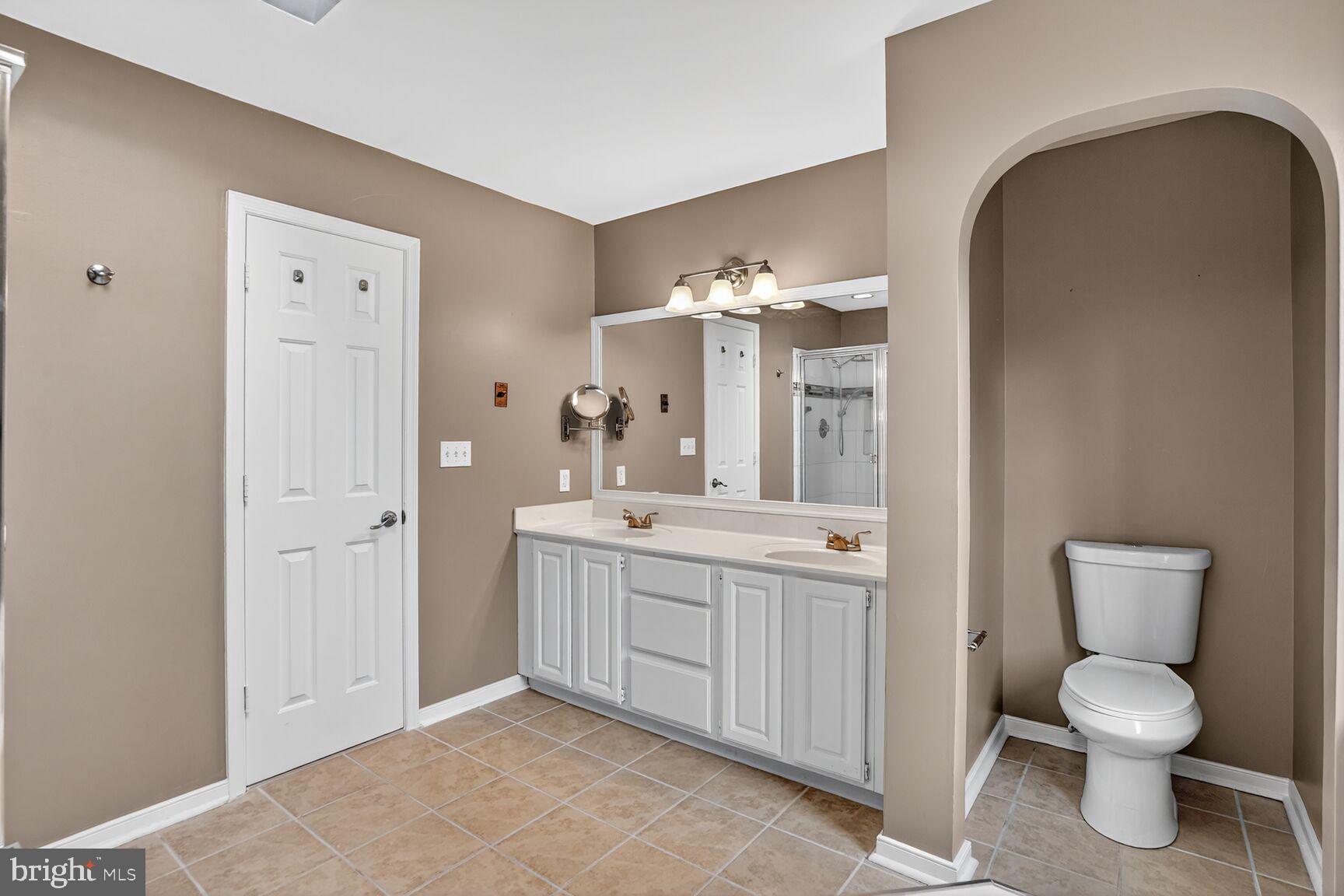 2008 State Stafford, VA 22554 - Photo 22 of 34 a spacious bathroom with a toilet sink and mirror