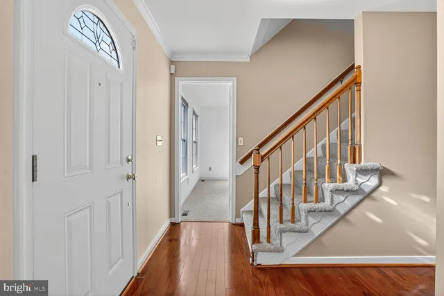 a view of entryway with wooden floor