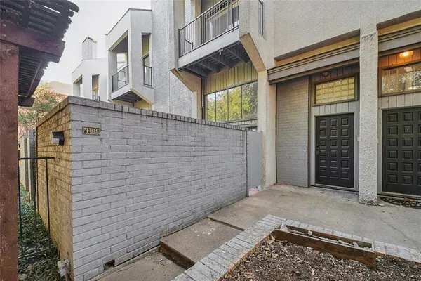 a view of a brick house with a street