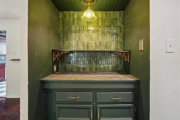 a bathroom with a sink and vanity
