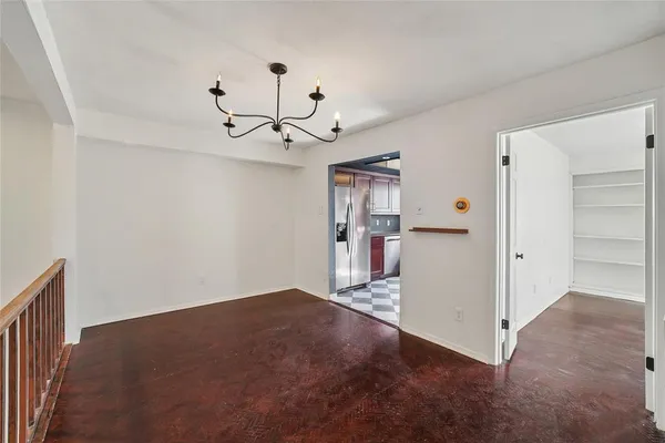 a view of a livingroom with a kitchen