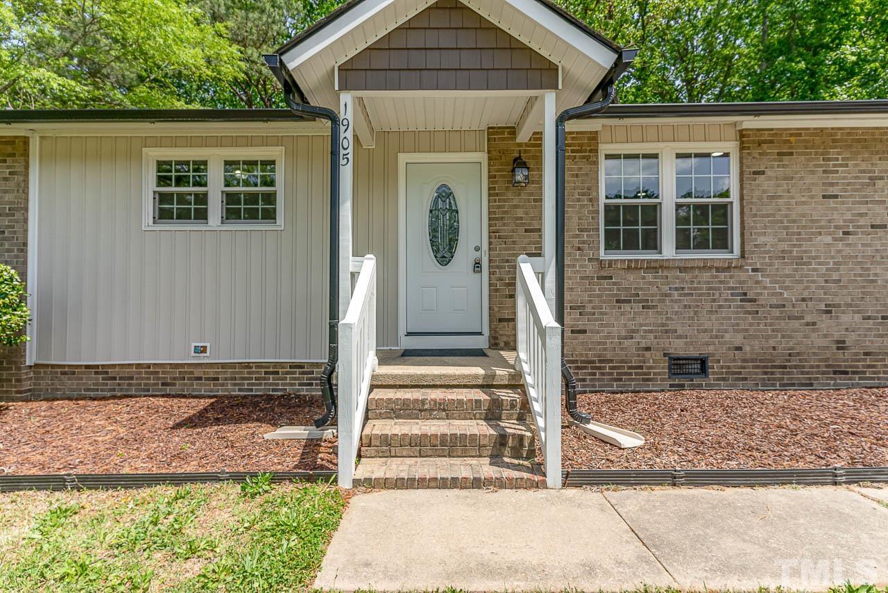 1905 Crawford Road Raleigh, NC 27610 - Photo 3 of 16 a front view of a house with garden