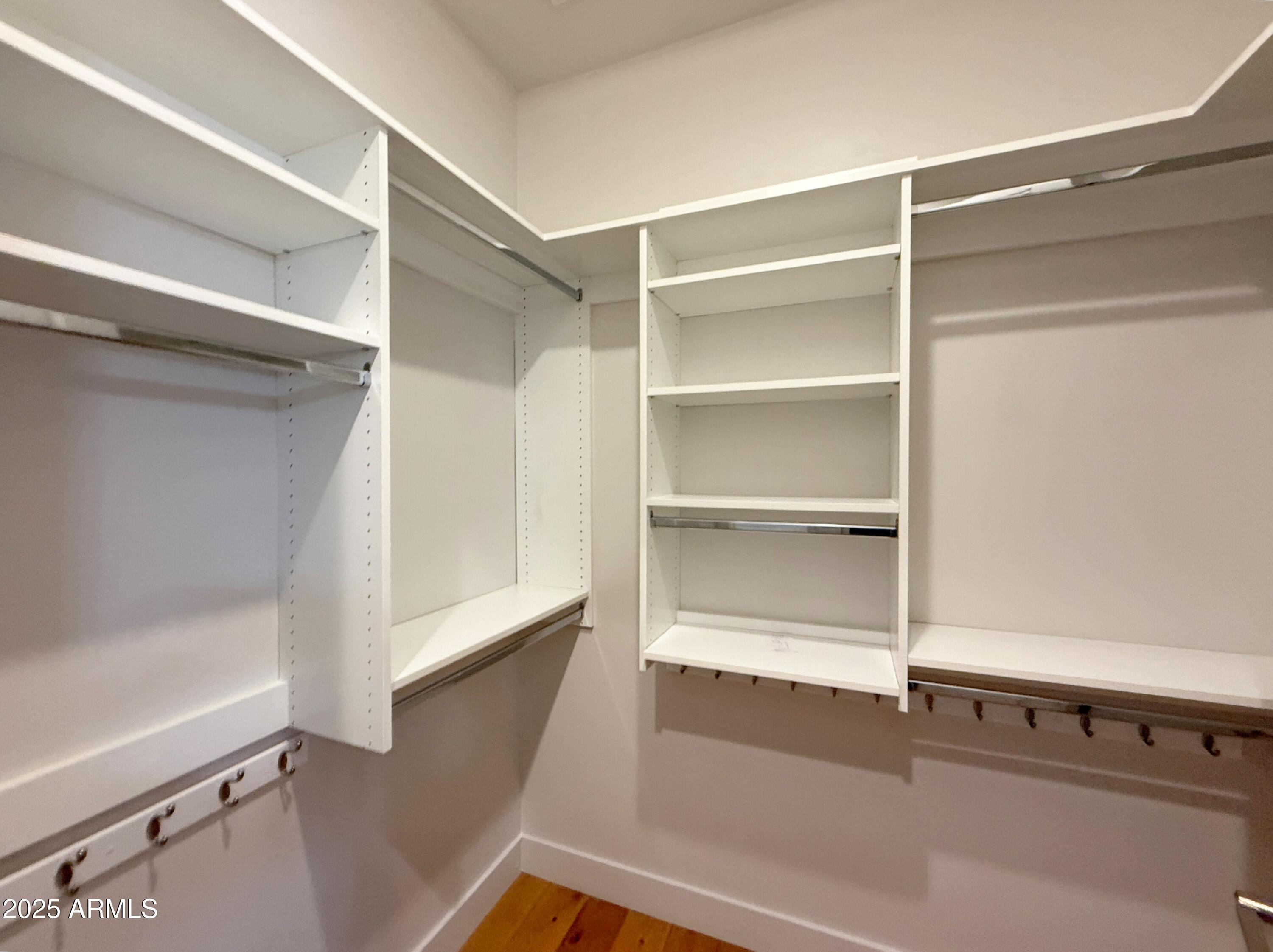 3131 North Central Avenue, Unit 7004 Phoenix, AZ 85012 - Photo 15 of 26 a view of walk in closet with empty racks
