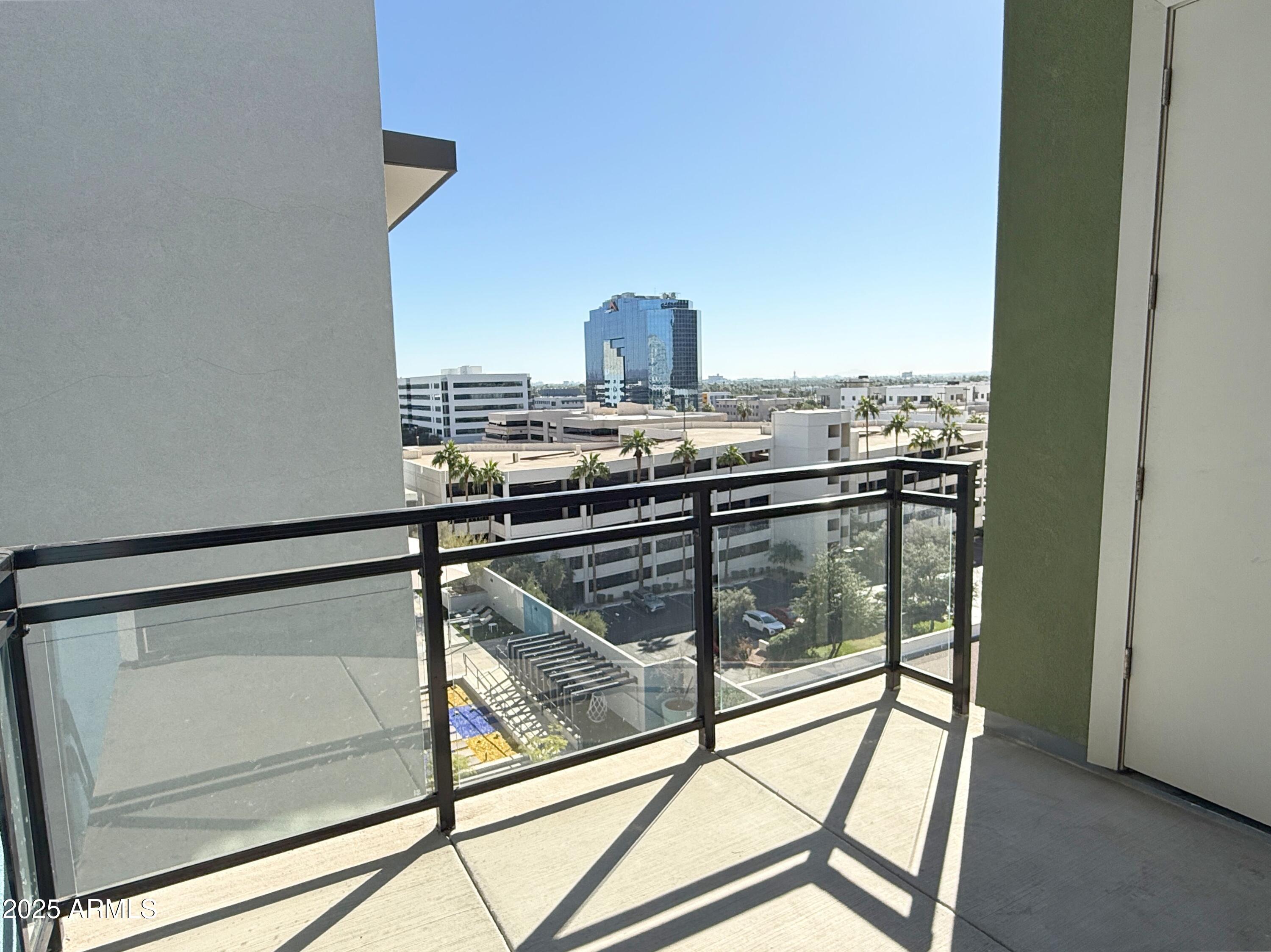 3131 North Central Avenue, Unit 7004 Phoenix, AZ 85012 - Photo 17 of 26 a view of a room with wooden floor