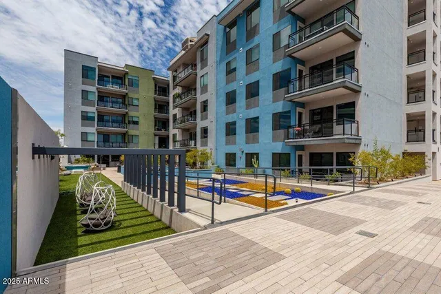 a view of a building with outdoor seating