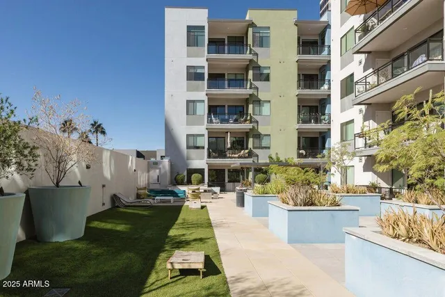 a view of a swimming pool with outdoor seating