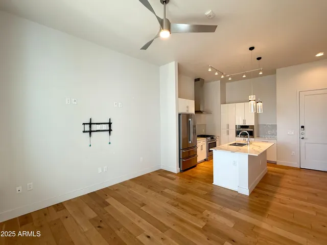 a view of kitchen with wooden floor