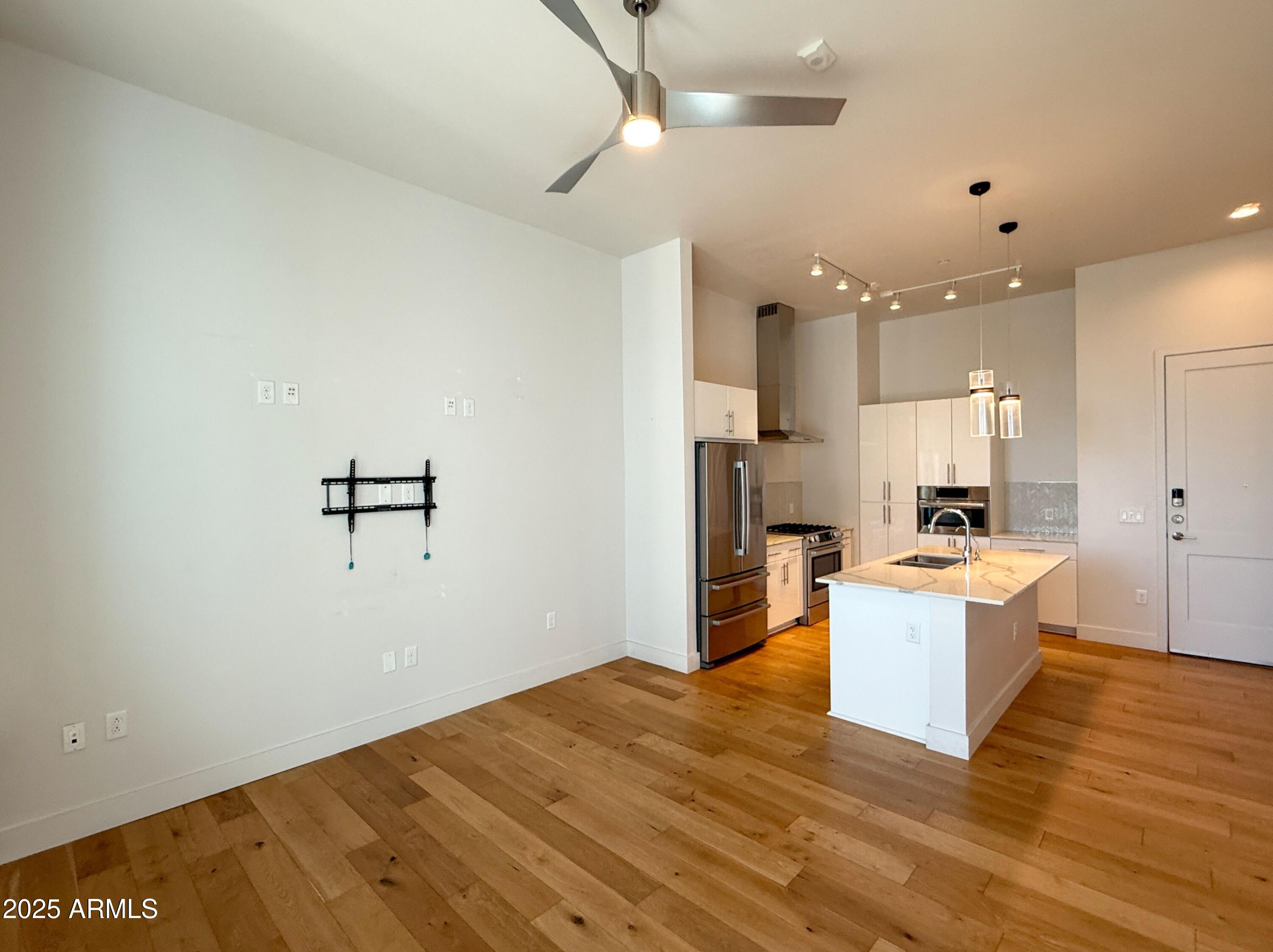 3131 North Central Avenue, Unit 7004 Phoenix, AZ 85012 - Photo 3 of 26 a view of kitchen with wooden floor
