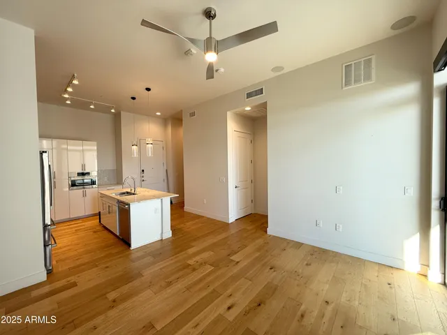 a view of a kitchen and a refrigerator chandelier