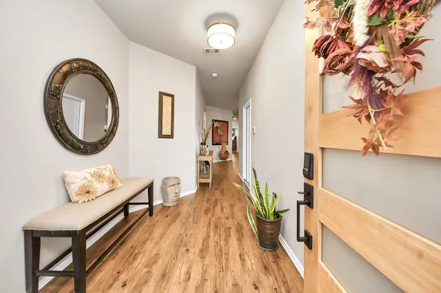 a view of a livingroom with furniture and wooden floor