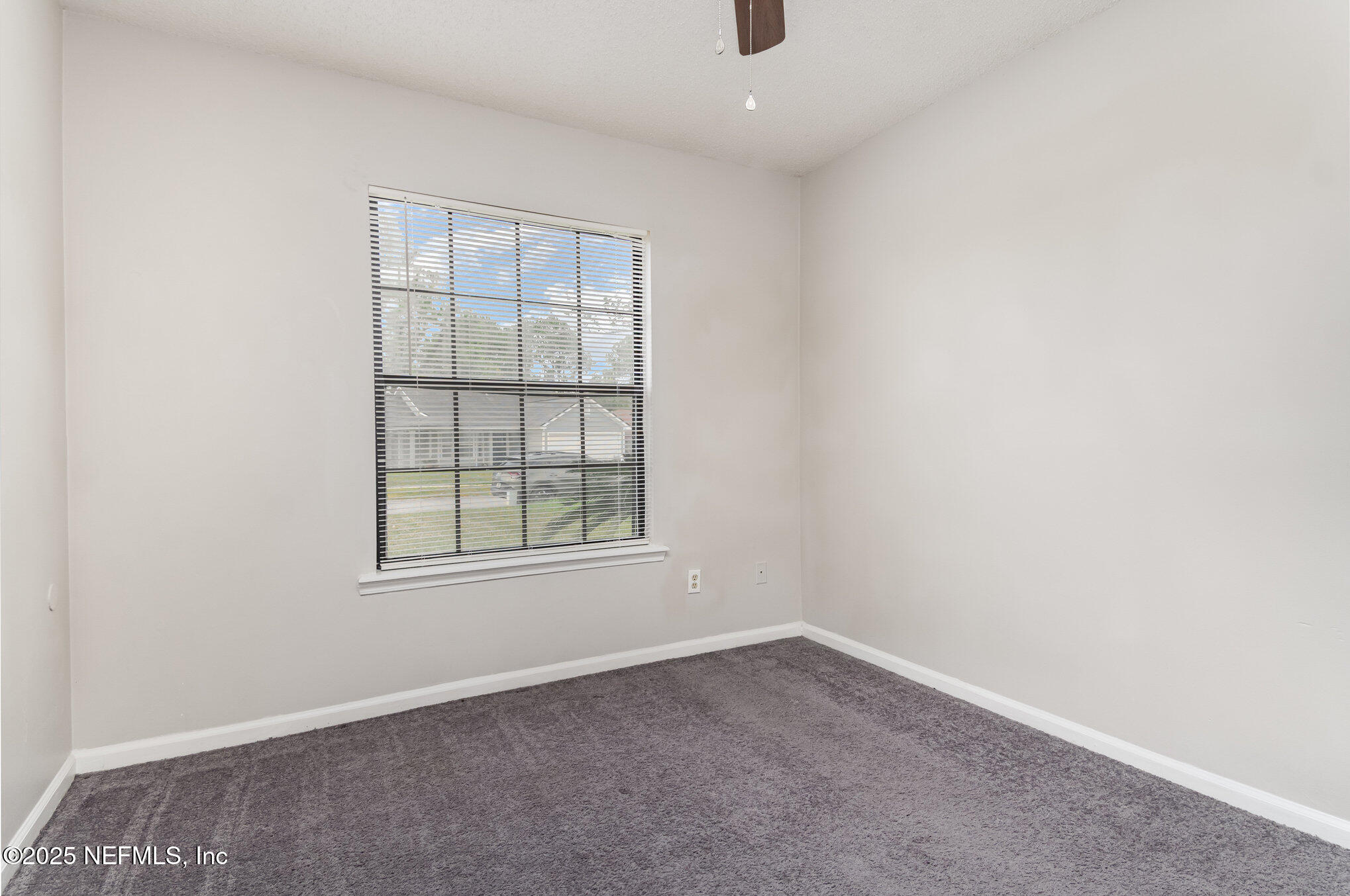 7945 Amandas Crossing Drive East Jacksonville, FL 32244 - Photo 3 of 15 an empty room with a window