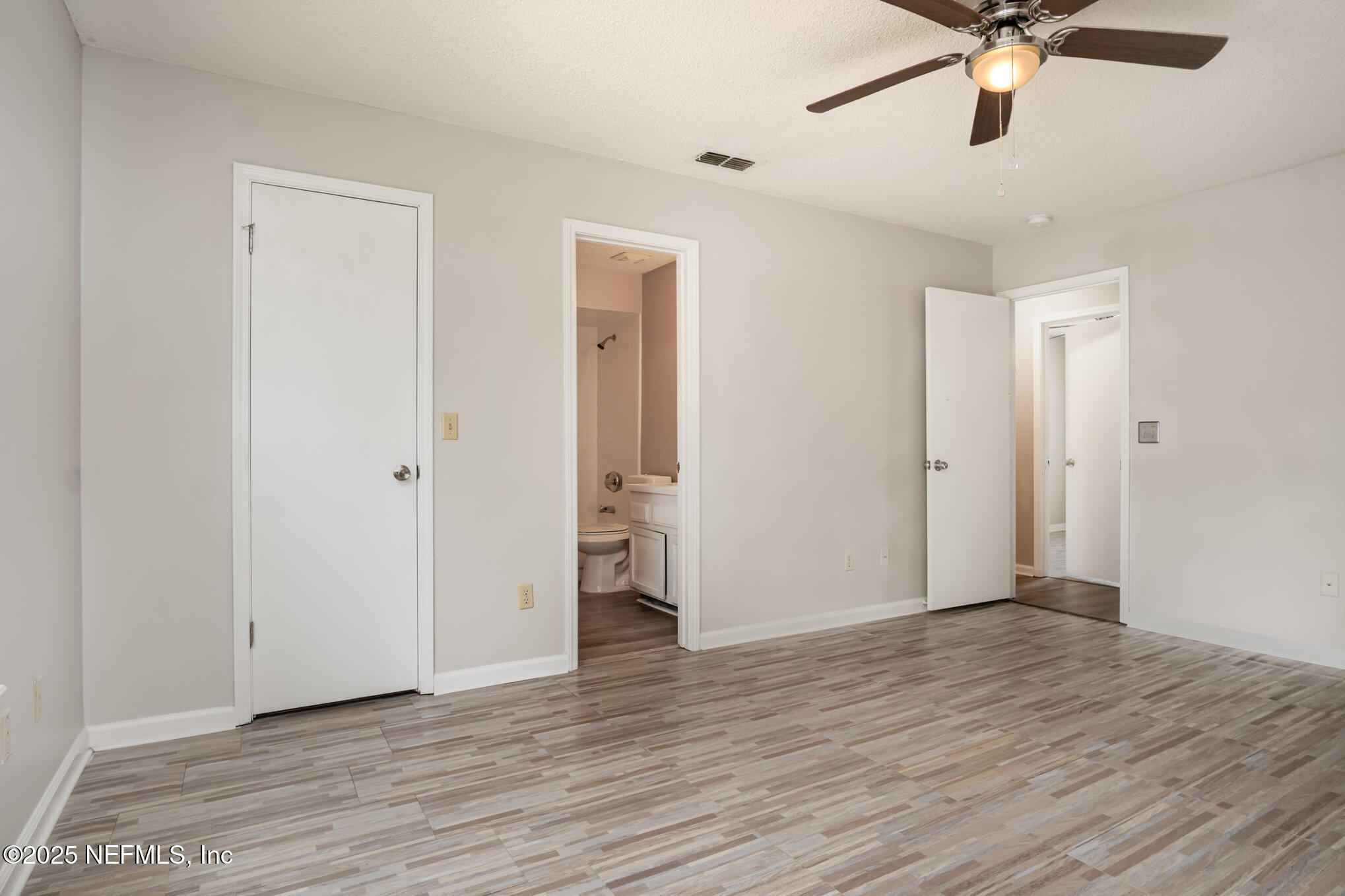 7945 Amandas Crossing Drive East Jacksonville, FL 32244 - Photo 5 of 15 a view of an empty room with wooden floor