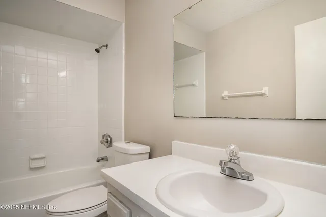 a bathroom with a toilet a sink and a bathtub