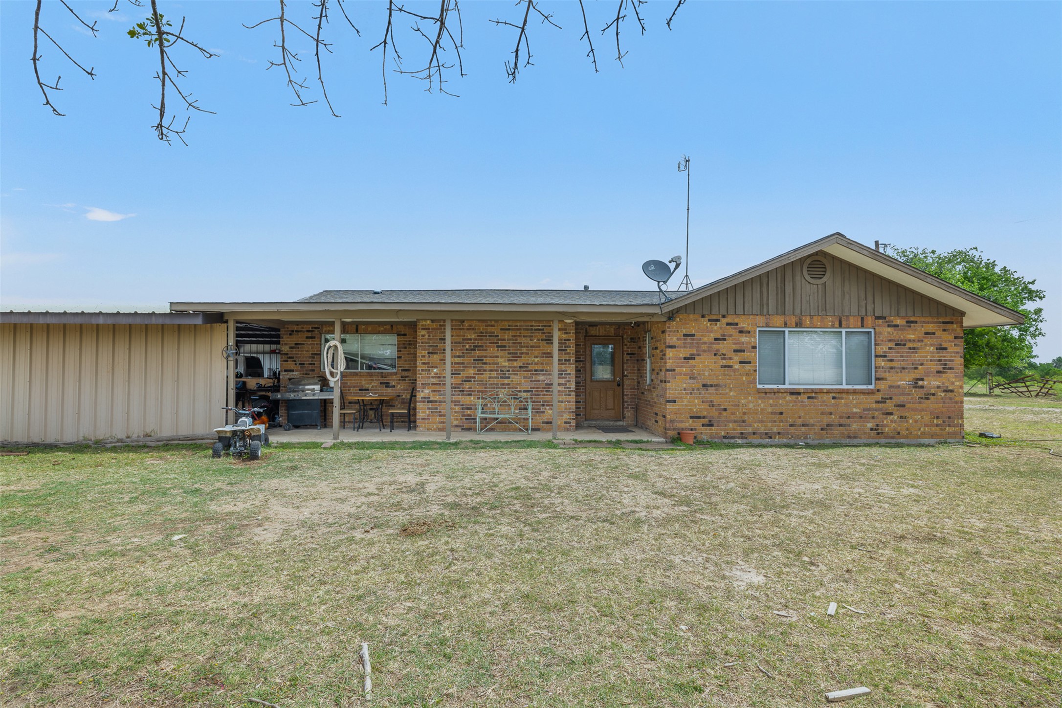 9765 State Park Road Lockhart, TX 78644 - Photo 13 of 40 a view of a house with a yard and sitting area