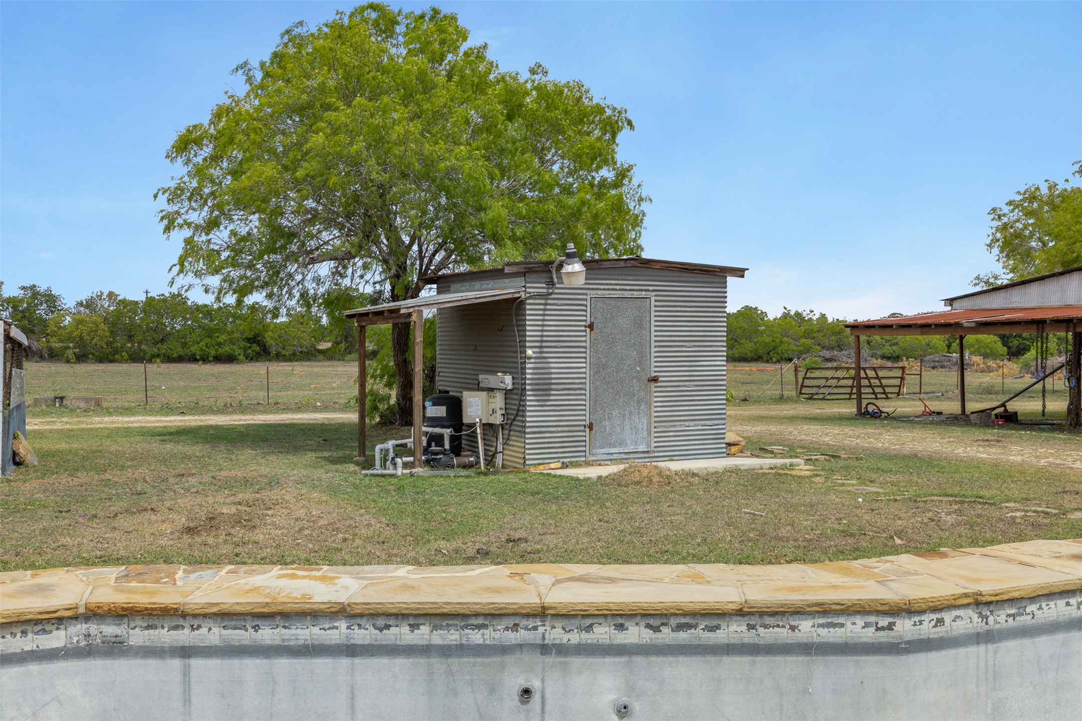 9765 State Park Road Lockhart, TX 78644 - Photo 17 of 40 a view of a backyard