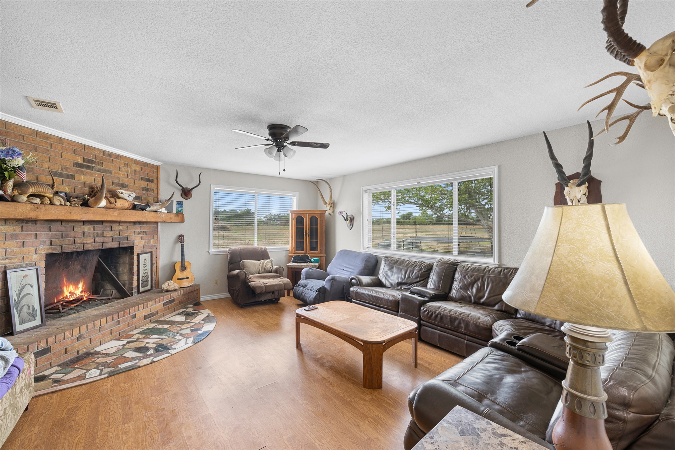 9765 State Park Road Lockhart, TX 78644 - Photo 20 of 40 a living room with furniture and a fireplace