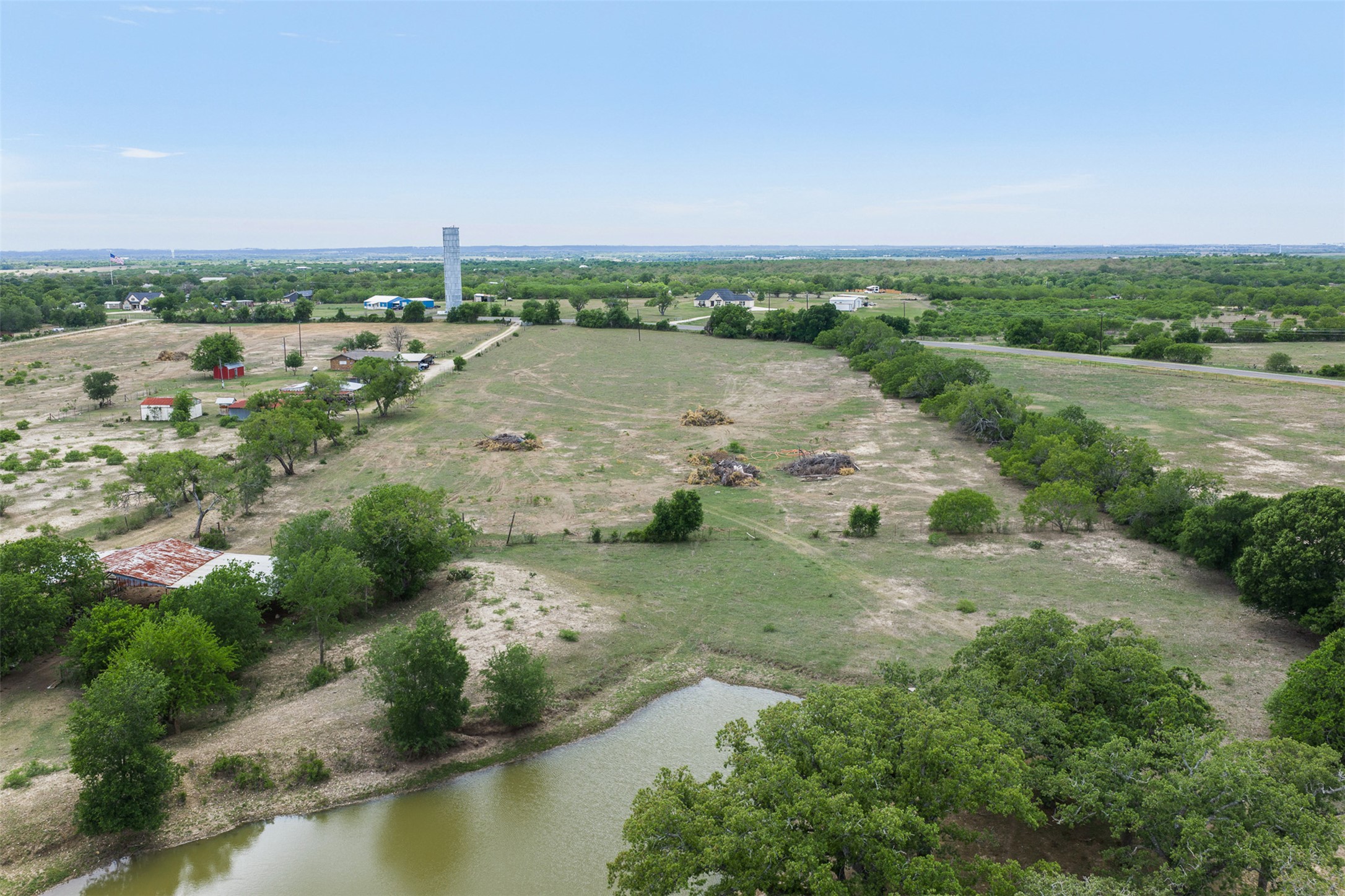 9765 State Park Road Lockhart, TX 78644 - Photo 5 of 40 an aerial view of a houses with ocean view