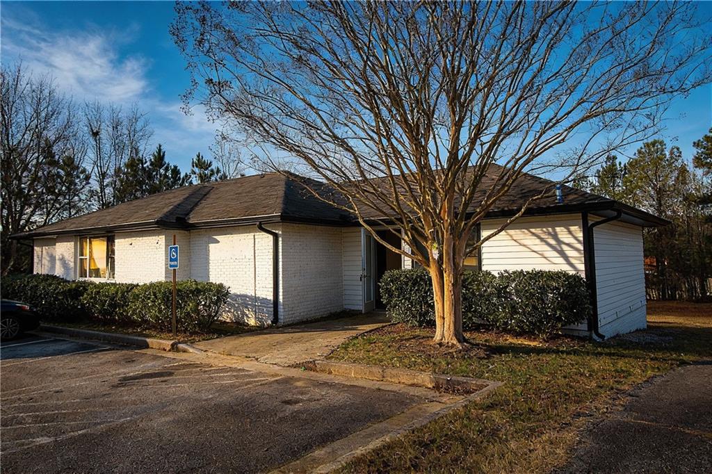 706 Collins Hill Road Lawrenceville, GA 30046 - Photo 1 of 33 a front view of a house with a yard and garage